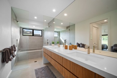 Modern Hawaiian Plantation style residence completed in 2022 and on Kiahuna Golf Club in Hawaii - for sale on GolfHomes.com, golf home, golf lot