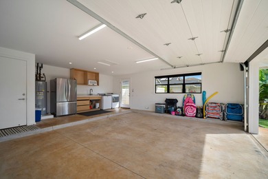 Modern Hawaiian Plantation style residence completed in 2022 and on Kiahuna Golf Club in Hawaii - for sale on GolfHomes.com, golf home, golf lot