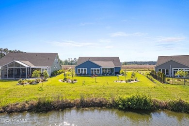 Experience refined coastal living in this beautifully appointed on Crow Creek Golf Club in North Carolina - for sale on GolfHomes.com, golf home, golf lot