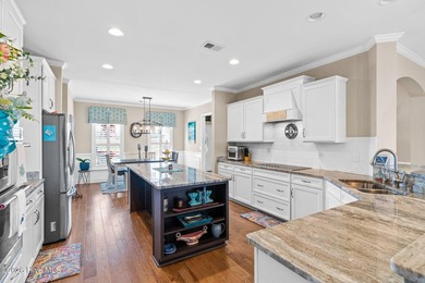 Experience refined coastal living in this beautifully appointed on Crow Creek Golf Club in North Carolina - for sale on GolfHomes.com, golf home, golf lot