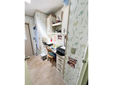 This charming two-bedroom, two-bathroom home is situated on a on Pine Lakes Country Club in Florida - for sale on GolfHomes.com, golf home, golf lot
