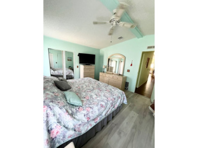 This charming two-bedroom, two-bathroom home is situated on a on Pine Lakes Country Club in Florida - for sale on GolfHomes.com, golf home, golf lot