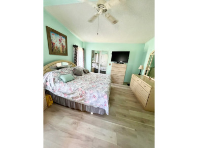 This charming two-bedroom, two-bathroom home is situated on a on Pine Lakes Country Club in Florida - for sale on GolfHomes.com, golf home, golf lot