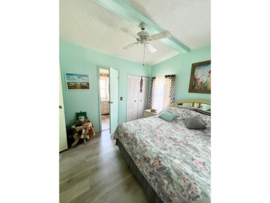This charming two-bedroom, two-bathroom home is situated on a on Pine Lakes Country Club in Florida - for sale on GolfHomes.com, golf home, golf lot