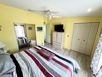 This charming two-bedroom, two-bathroom home is situated on a on Pine Lakes Country Club in Florida - for sale on GolfHomes.com, golf home, golf lot