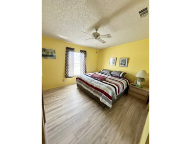 This charming two-bedroom, two-bathroom home is situated on a on Pine Lakes Country Club in Florida - for sale on GolfHomes.com, golf home, golf lot