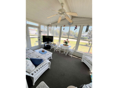 This charming two-bedroom, two-bathroom home is situated on a on Pine Lakes Country Club in Florida - for sale on GolfHomes.com, golf home, golf lot