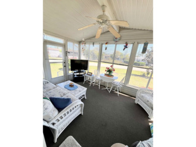 This charming two-bedroom, two-bathroom home is situated on a on Pine Lakes Country Club in Florida - for sale on GolfHomes.com, golf home, golf lot