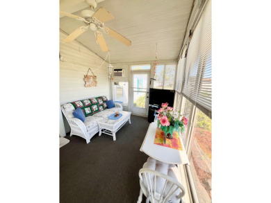 This charming two-bedroom, two-bathroom home is situated on a on Pine Lakes Country Club in Florida - for sale on GolfHomes.com, golf home, golf lot