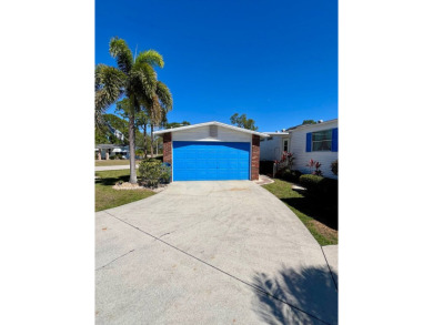 This charming two-bedroom, two-bathroom home is situated on a on Pine Lakes Country Club in Florida - for sale on GolfHomes.com, golf home, golf lot