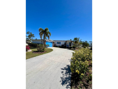This charming two-bedroom, two-bathroom home is situated on a on Pine Lakes Country Club in Florida - for sale on GolfHomes.com, golf home, golf lot