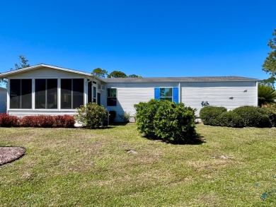 This charming two-bedroom, two-bathroom home is situated on a on Pine Lakes Country Club in Florida - for sale on GolfHomes.com, golf home, golf lot