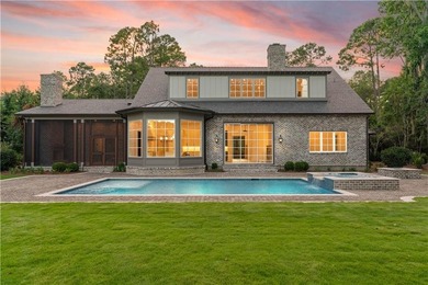 Step into a world of refined elegance with this stunning on Frederica Golf Club in Georgia - for sale on GolfHomes.com, golf home, golf lot