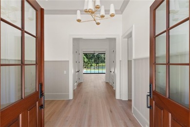 Step into a world of refined elegance with this stunning on Frederica Golf Club in Georgia - for sale on GolfHomes.com, golf home, golf lot