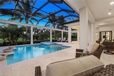 Step into unparalleled luxury in the prestigious Marsh Cove in on The Golf Club At Fiddlers Creek in Florida - for sale on GolfHomes.com, golf home, golf lot