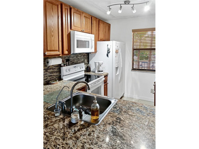 Motivated Seller! Enjoy stunning golf course and lake views from on Sunrise Lakes Phase IV Golf Course in Florida - for sale on GolfHomes.com, golf home, golf lot