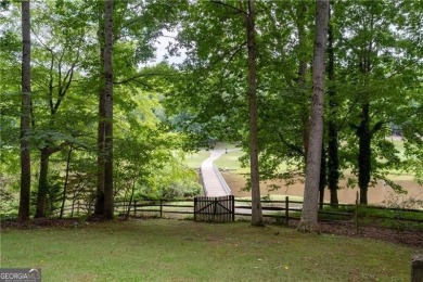 *Spectacular views of the EAGLE WATCH GOLF COURSE, tranquil POND on Canongate At Eagle Watch Golf Club in Georgia - for sale on GolfHomes.com, golf home, golf lot