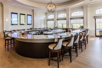 Enjoy golf & pond views from your paver lanai w/pool & spa in on The Club At Grandezza in Florida - for sale on GolfHomes.com, golf home, golf lot
