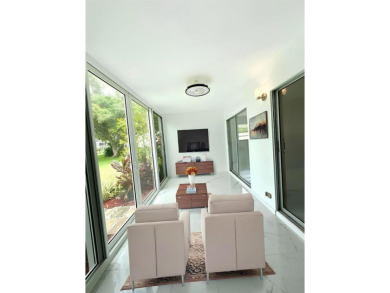 BRAND-NEW IMPACT SLIDING GLASS DOOR INSTALLED, Expanding the on Hillsboro Pines Golf in Florida - for sale on GolfHomes.com, golf home, golf lot