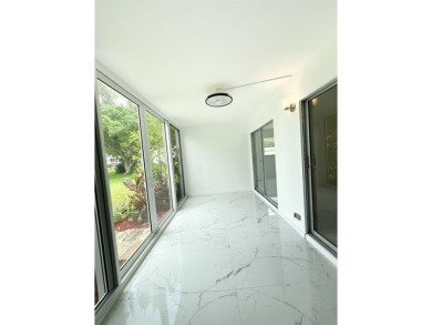 BRAND-NEW IMPACT SLIDING GLASS DOOR INSTALLED, Expanding the on Hillsboro Pines Golf in Florida - for sale on GolfHomes.com, golf home, golf lot