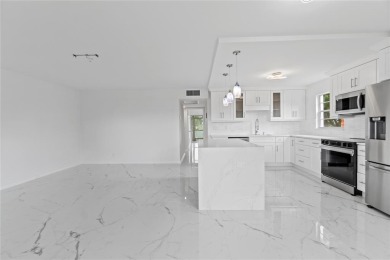 BRAND-NEW IMPACT SLIDING GLASS DOOR INSTALLED, Expanding the on Hillsboro Pines Golf in Florida - for sale on GolfHomes.com, golf home, golf lot