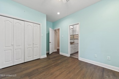 Beautifully Maintained 4-Bedroom Home sitting on two on Diamondhead Country Club in Mississippi - for sale on GolfHomes.com, golf home, golf lot
