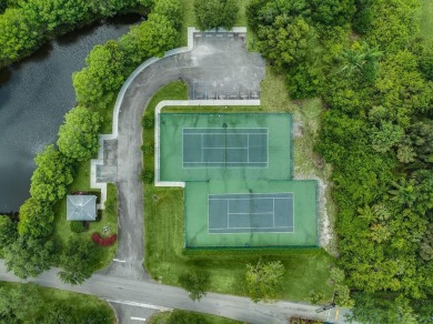 Serene Lake Views & Modern Upgrades Await! This beautifully on Pine Lakes Golf Club in Florida - for sale on GolfHomes.com, golf home, golf lot