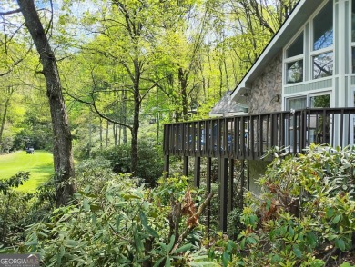 Follow the paved, winding driveway, through a Rhododendron on Sky Valley Resort and Country Club in Georgia - for sale on GolfHomes.com, golf home, golf lot