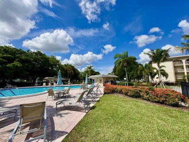 FOR SALE- Step into style and comfort with this beautifully on Wynmoor Golf Course in Florida - for sale on GolfHomes.com, golf home, golf lot