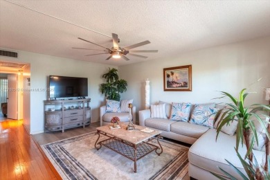 Discover a vibrant lifestyle in the 55+ community of Century on Hillsboro Pines Golf in Florida - for sale on GolfHomes.com, golf home, golf lot