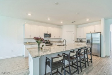 Discover refined living in this impeccably crafted home in the on Valencia Golf and Country Club in Florida - for sale on GolfHomes.com, golf home, golf lot