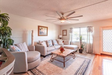 Discover a vibrant lifestyle in the 55+ community of Century on Hillsboro Pines Golf in Florida - for sale on GolfHomes.com, golf home, golf lot