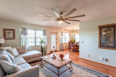 Discover a vibrant lifestyle in the 55+ community of Century on Hillsboro Pines Golf in Florida - for sale on GolfHomes.com, golf home, golf lot