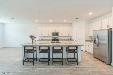 Discover refined living in this impeccably crafted home in the on Valencia Golf and Country Club in Florida - for sale on GolfHomes.com, golf home, golf lot