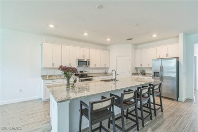 Discover refined living in this impeccably crafted home in the on Valencia Golf and Country Club in Florida - for sale on GolfHomes.com, golf home, golf lot