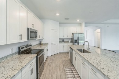 Discover refined living in this impeccably crafted home in the on Valencia Golf and Country Club in Florida - for sale on GolfHomes.com, golf home, golf lot