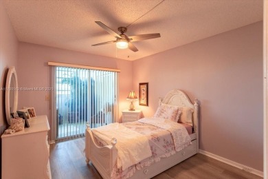 Discover a vibrant lifestyle in the 55+ community of Century on Hillsboro Pines Golf in Florida - for sale on GolfHomes.com, golf home, golf lot