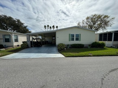 Location, Location, Location! This generously sized home is on Lake Henry Golf Club in Florida - for sale on GolfHomes.com, golf home, golf lot