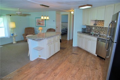 Light, airy, and inviting, this beautifully updated home is on Six Lakes Country Club in Florida - for sale on GolfHomes.com, golf home, golf lot