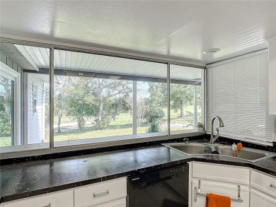 This property listing highlights a spacious home located near on Deltona Golf Club in Florida - for sale on GolfHomes.com, golf home, golf lot