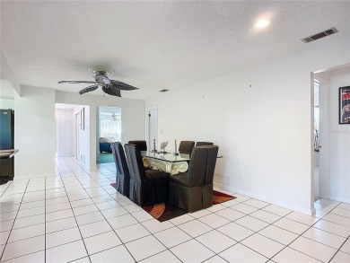 This property listing highlights a spacious home located near on Deltona Golf Club in Florida - for sale on GolfHomes.com, golf home, golf lot