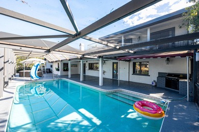 Come experience this impressive 6-bedroom, 5-bath residence with on St. Lucie Trail Golf Club in Florida - for sale on GolfHomes.com, golf home, golf lot