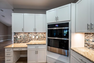 Come experience this impressive 6-bedroom, 5-bath residence with on St. Lucie Trail Golf Club in Florida - for sale on GolfHomes.com, golf home, golf lot