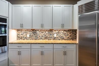 Come experience this impressive 6-bedroom, 5-bath residence with on St. Lucie Trail Golf Club in Florida - for sale on GolfHomes.com, golf home, golf lot