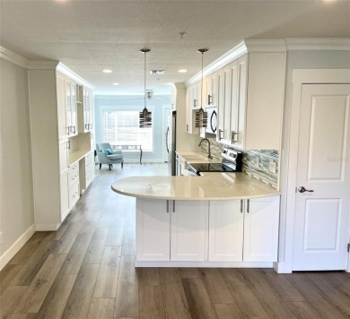 If you are looking for a fully updated, ground floor, lakefront on On Top Of The World Golf Course in Florida - for sale on GolfHomes.com, golf home, golf lot