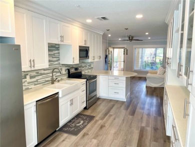 If you are looking for a fully updated, ground floor, lakefront on On Top Of The World Golf Course in Florida - for sale on GolfHomes.com, golf home, golf lot