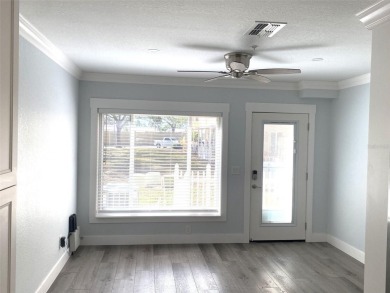 If you are looking for a fully updated, ground floor, lakefront on On Top Of The World Golf Course in Florida - for sale on GolfHomes.com, golf home, golf lot