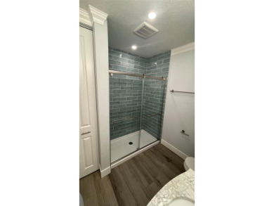 If you are looking for a fully updated, ground floor, lakefront on On Top Of The World Golf Course in Florida - for sale on GolfHomes.com, golf home, golf lot