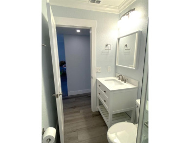 If you are looking for a fully updated, ground floor, lakefront on On Top Of The World Golf Course in Florida - for sale on GolfHomes.com, golf home, golf lot