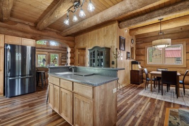 Escape the ordinary in this stunning log home sitting on just on Chewelah Golf and Country Club  in Washington - for sale on GolfHomes.com, golf home, golf lot